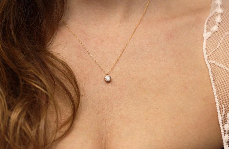 My mom's .5 carat engagement diamond set in a pendant : r/Diamonds